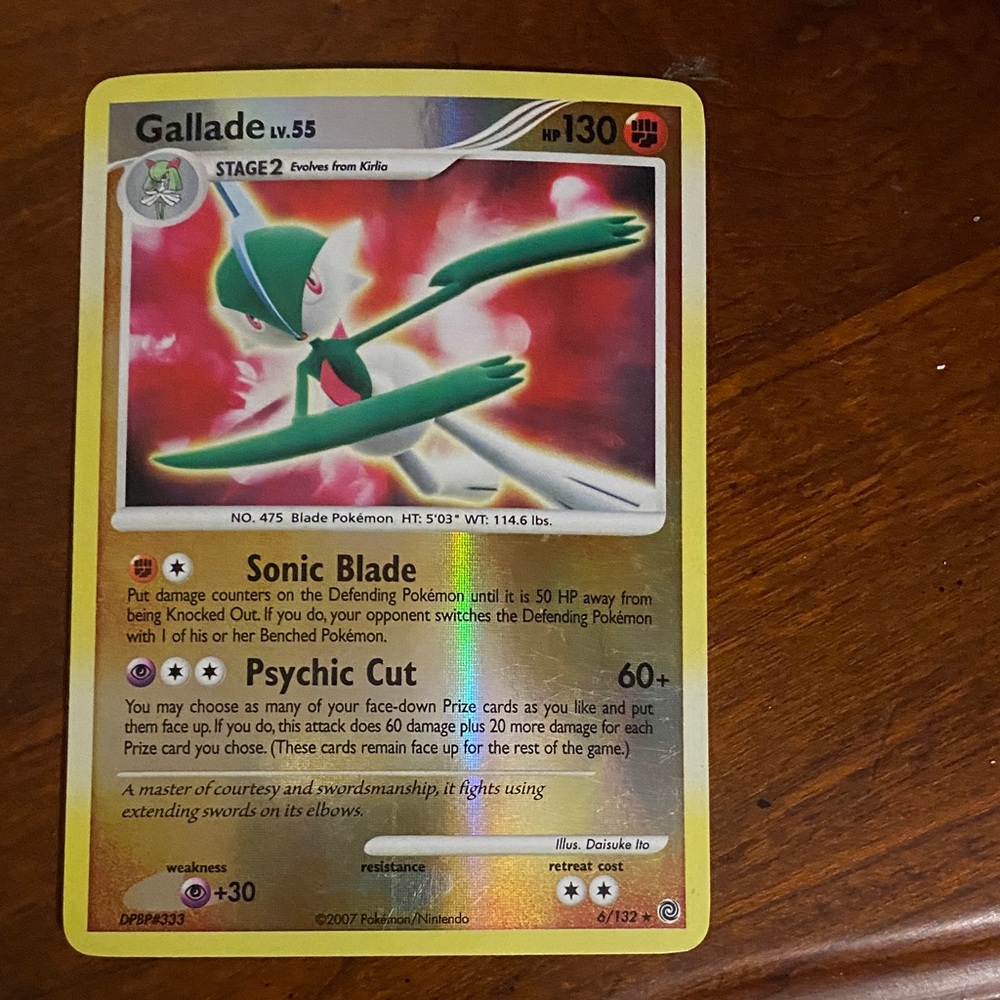Pokemon Gallade Card with Red and Green Accents